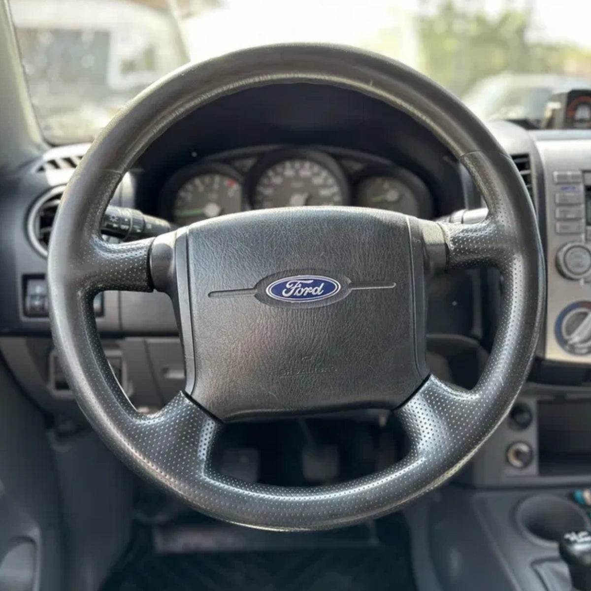 Custom-fit ArcYaY steering wheel cover for Ford Ranger 1998–2006. Hand-stitched luxury grip, OEM-fit upgrade-boosts comfort & style. Fast shipping-order today!
