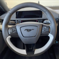 ArcYaY steering cover for the Ford Mustang Mach-E EV (21-25). Adds comfort, protects the wheel, and complements the sporty interior design.
