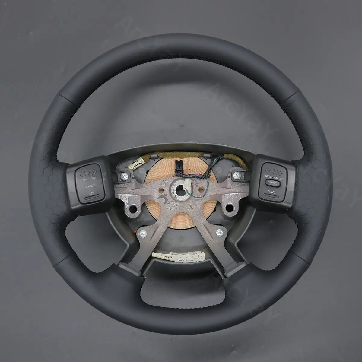 ArcYaY delivers a custom, hand-stitched, rugged steering wheel cover for Dodge Ram SRT-10 Dakota (2004-2011). Enjoy enhanced grip and style every drive.
