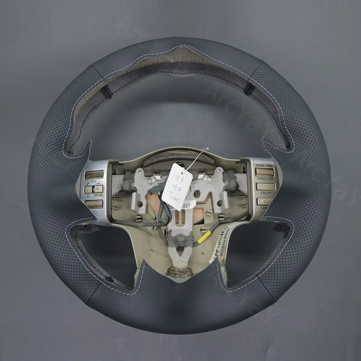 ArcYaY's rugged steering wheel cover for Nissan Titan 2004-2012 is designed for durability and a perfect fit, ideal for any adventure.
