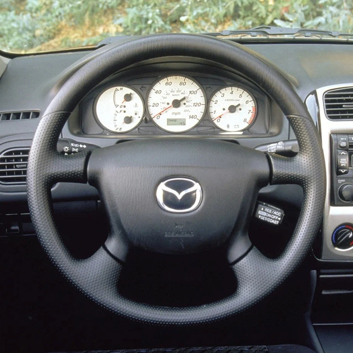 ArcYaY's rugged steering wheel cover for Mazda BT-50 2006-2011 is designed for durability and a perfect fit, ideal for any adventure.