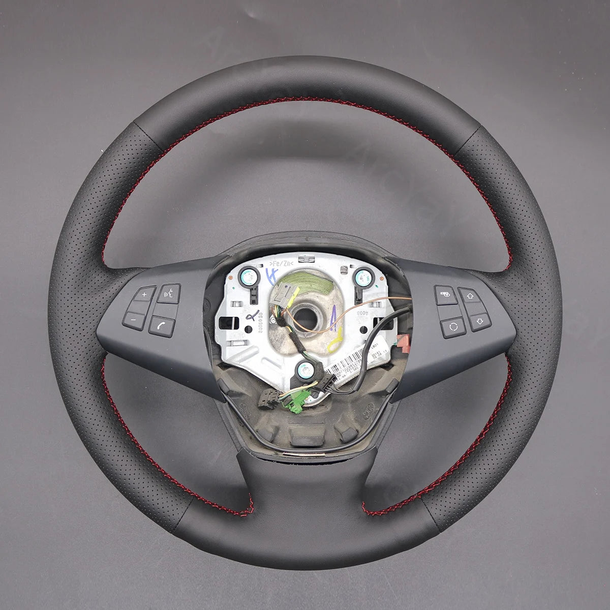 Premium steering wheel cover fits BMW X5 E70 (2006-2013). Enhances driving feel and protects the wheel.