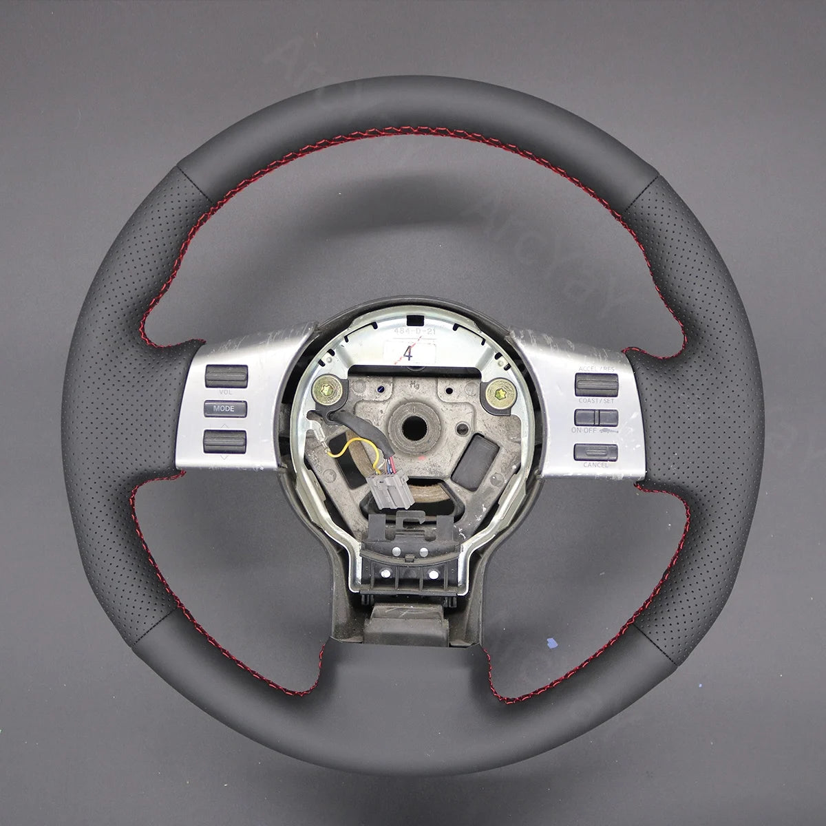 Steering wheel cover for Infiniti FX45 2004-2008. Provides a comfortable grip and sleek look.