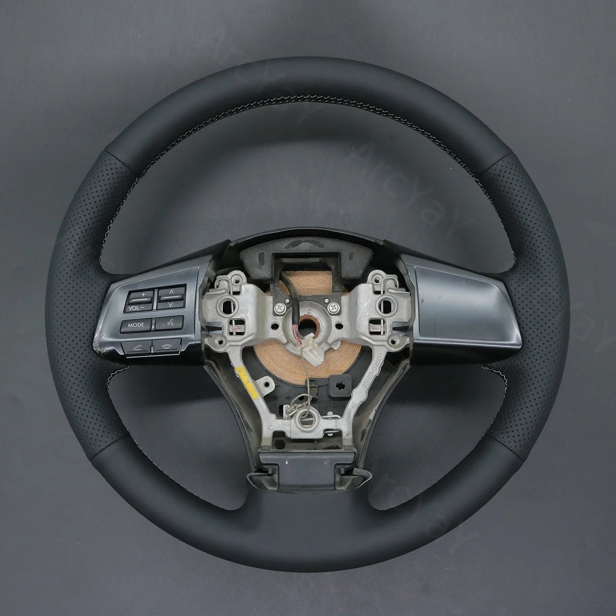 Tailored steering wheel cover for Subaru XV, Crosstrek, Forester 2013-2016. Adds premium comfort and style to your driving experience.