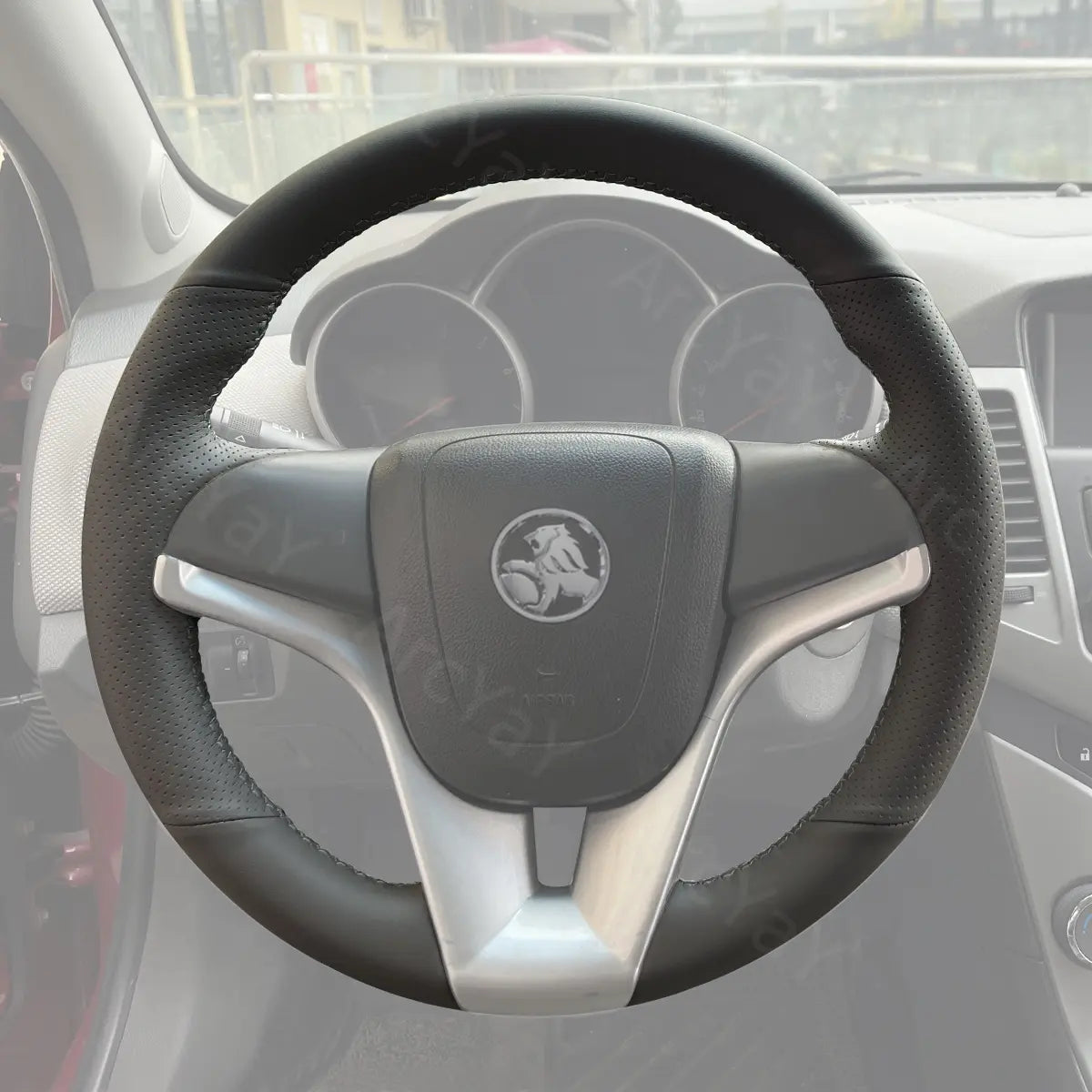 Custom steering wheel cover for Holden Cruze (2009-2016). Designed for comfort, durability, and style for your sedan's steering wheel.