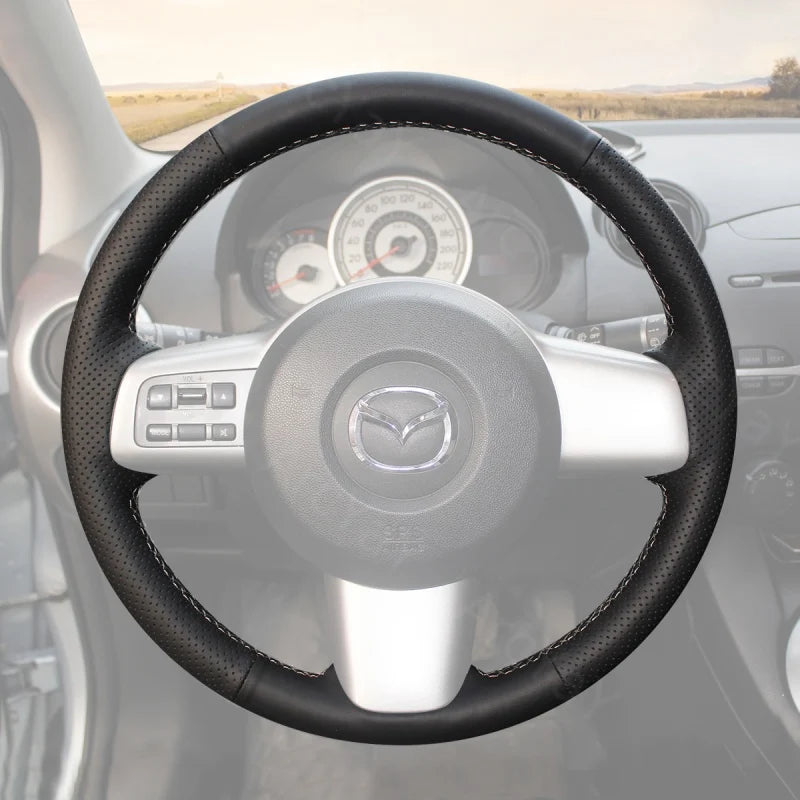 Add a touch of luxury and comfort to your Mazda 2 2008-2014 with the ArcYaY custom hand-sewn steering wheel cover. This cover offers a tailored fit, improved grip, and durability, enhancing your driving experience and providing a premium look and feel.
