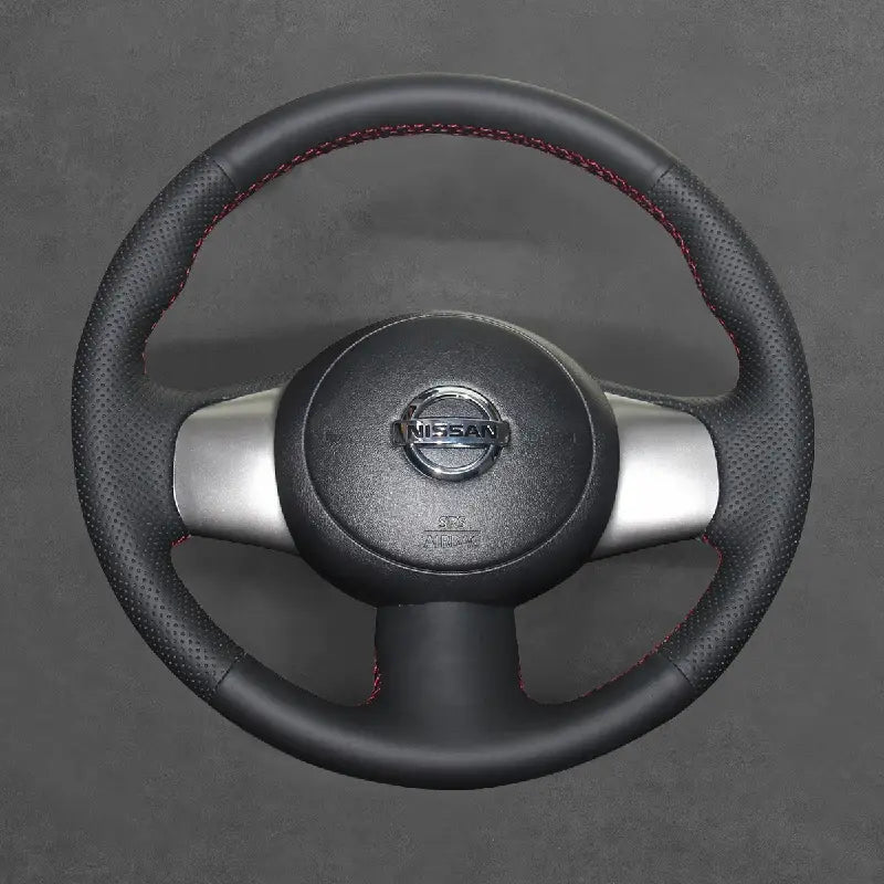 Enhance your Nissan Cube, Micra K13, NV200, Versa, Cube Z12, or Note 2008-2017 with the ArcYaY custom hand-sewn steering wheel cover. Designed for an exact fit, it improves grip, comfort, and durability, providing a luxurious feel for your vehicle's interior.
