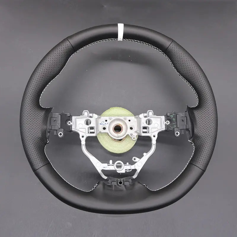 Add style to your Toyota Aygo 2 (2014-2021) with ArcYaY's custom leather steering wheel cover. Offering a perfect fit, this cover is crafted for durability and superior comfort.
